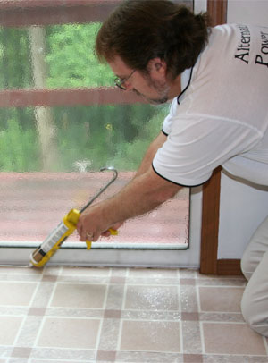 caulking cracks along doors and windows